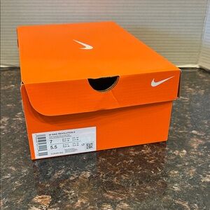 Size 7 Nike Orange Box with White Swoosh Logo (W Nike Revolution 8)